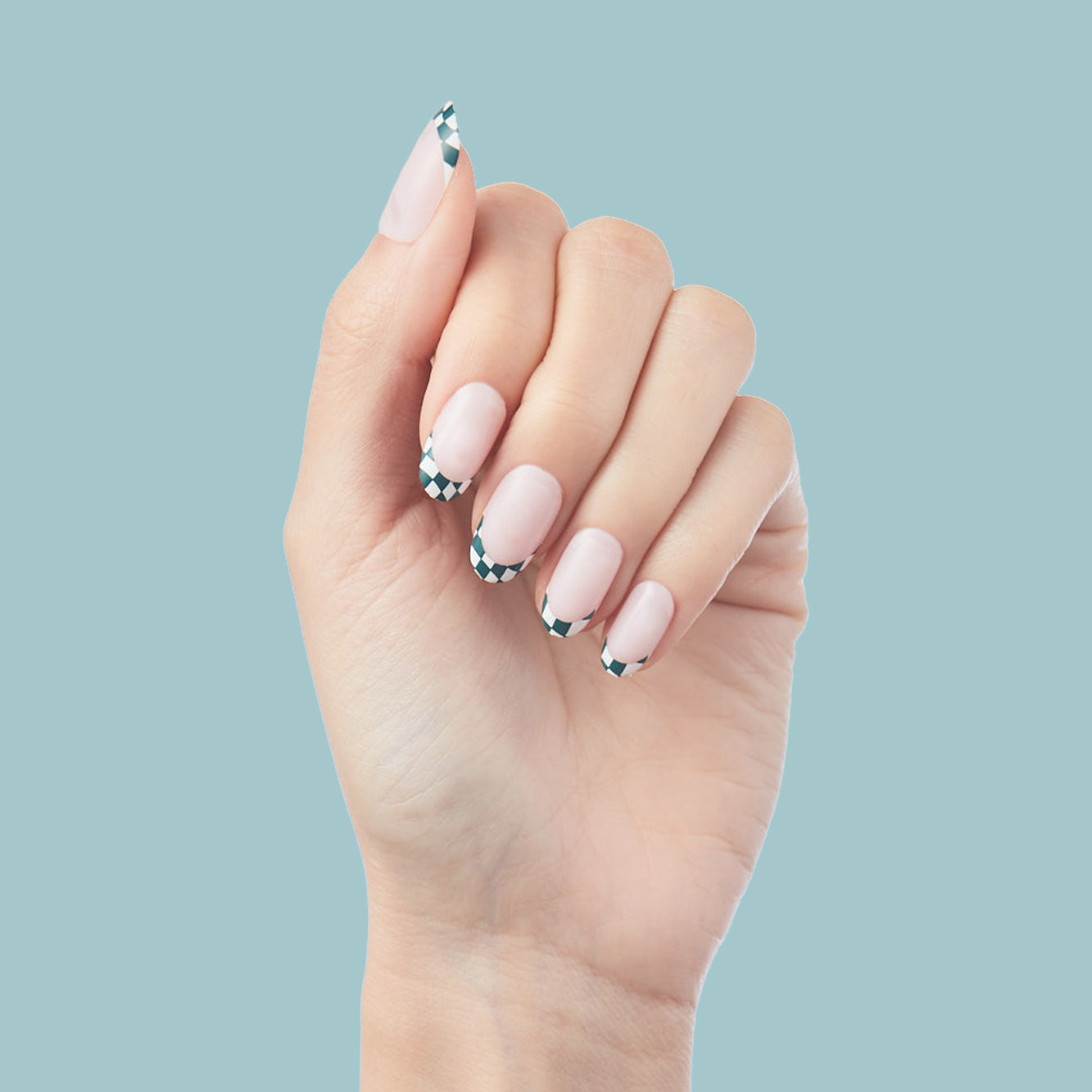 Checkerboard French - Press-On | Short | Round hand with short round false nails featuring black and white checkered French tips on nude base