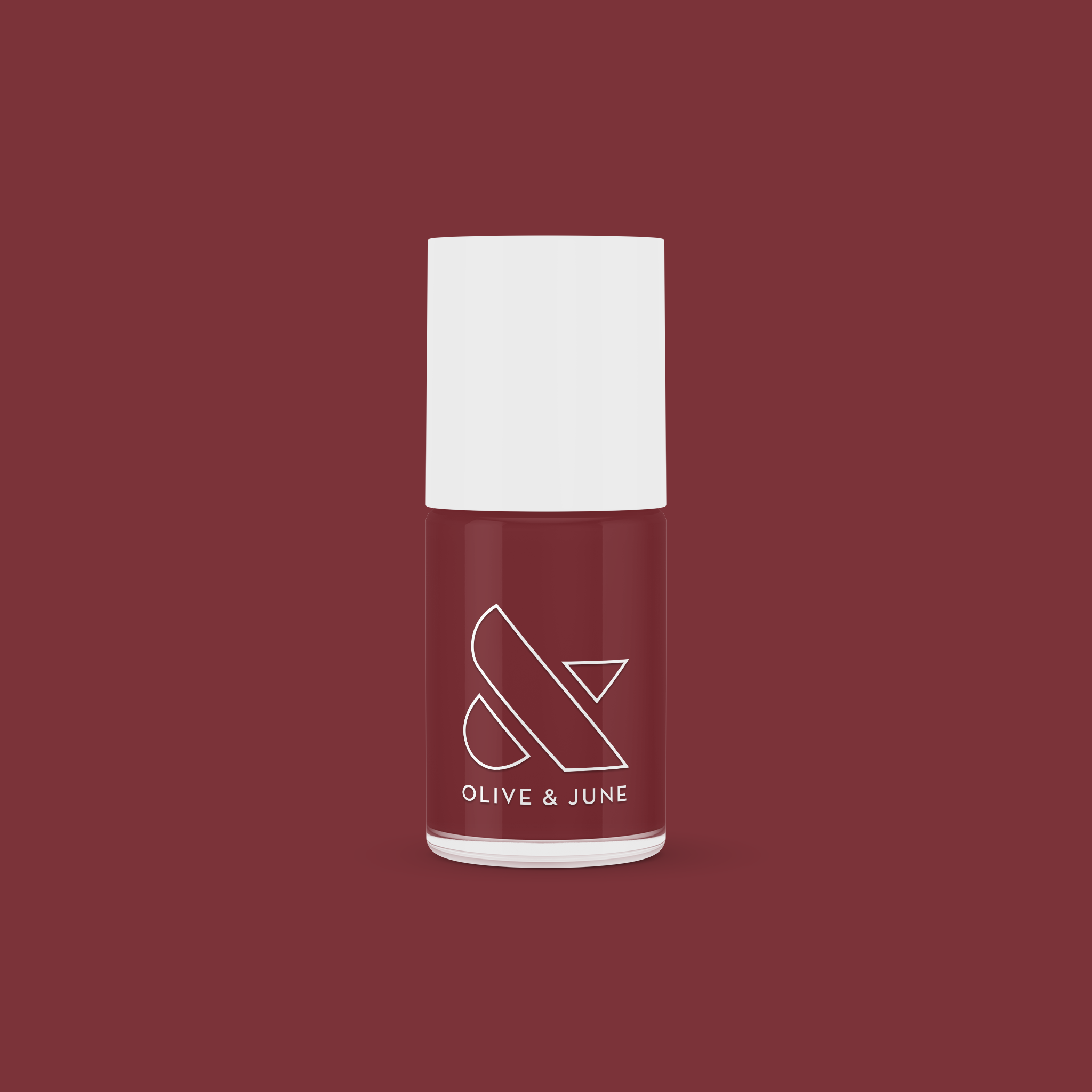 Bottle of JJ nail polish by Olive and June in a rich cinnamon brown shade for at-home manicures and pedis