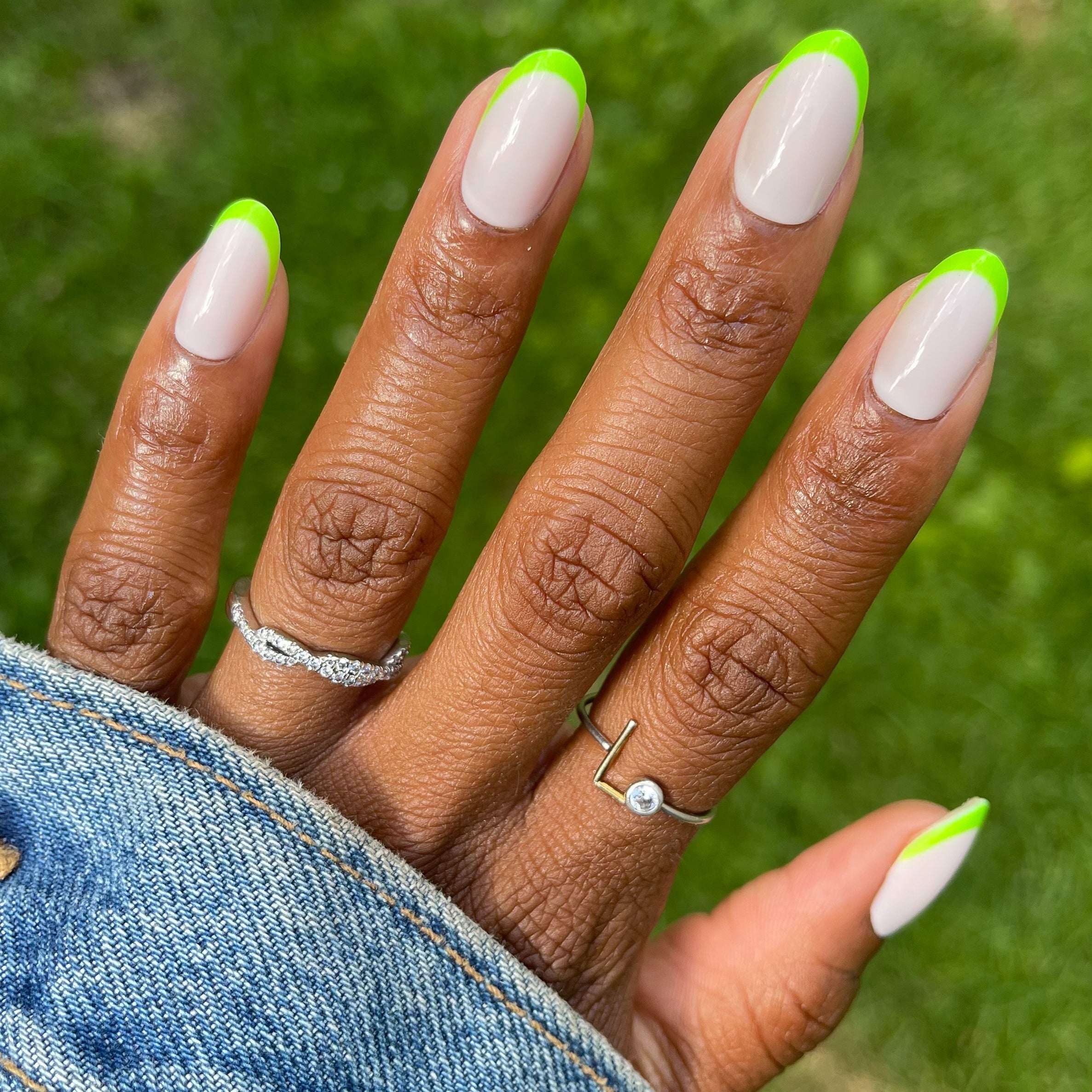 Neon Lime French | Oval | Medium press-on nails with a neutral base and bright neon lime tips for an easy at-home manicure