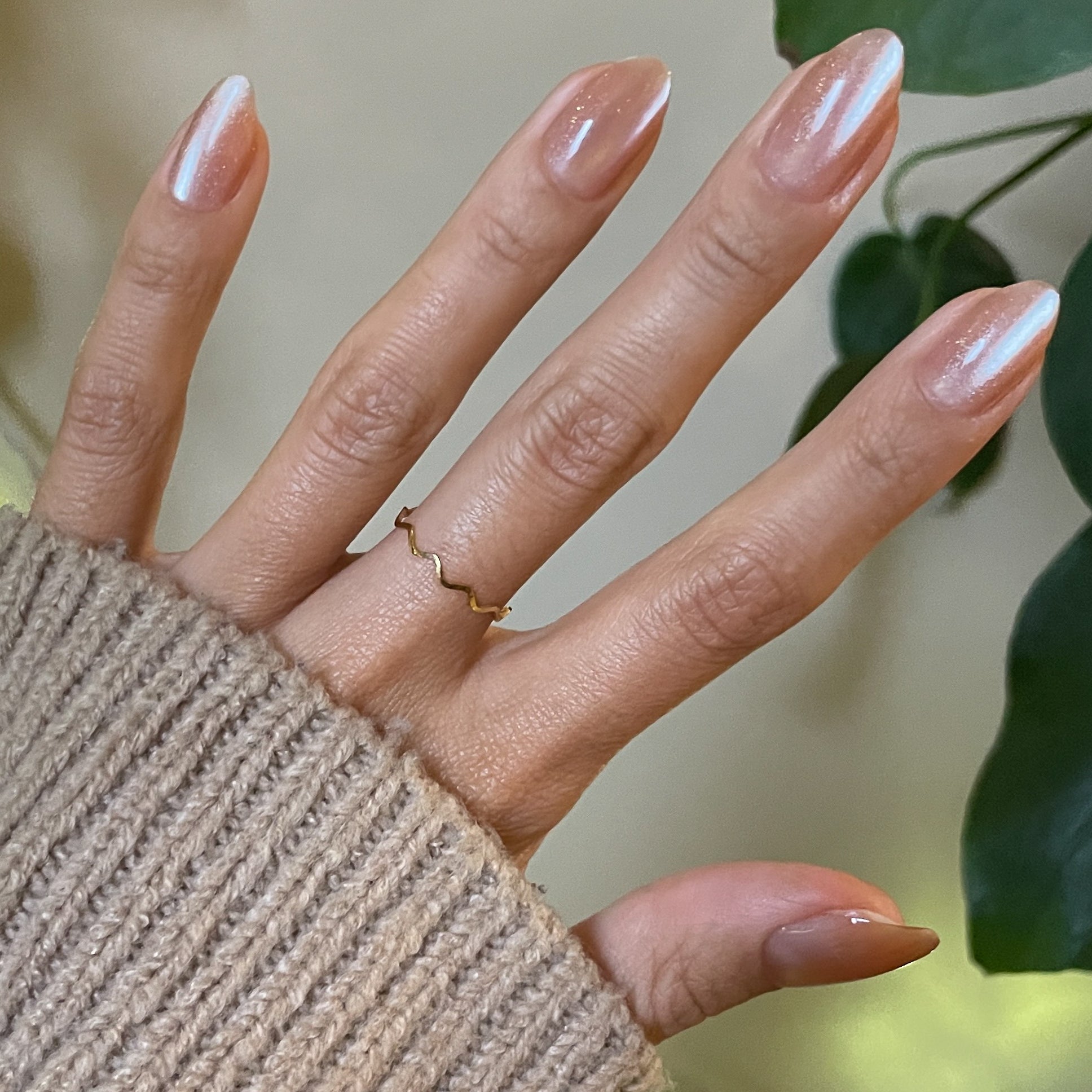 Velvet KAG - Press-On | Medium | Almond neutral peach velvet cateye medium almond nails on hand with beige sweater