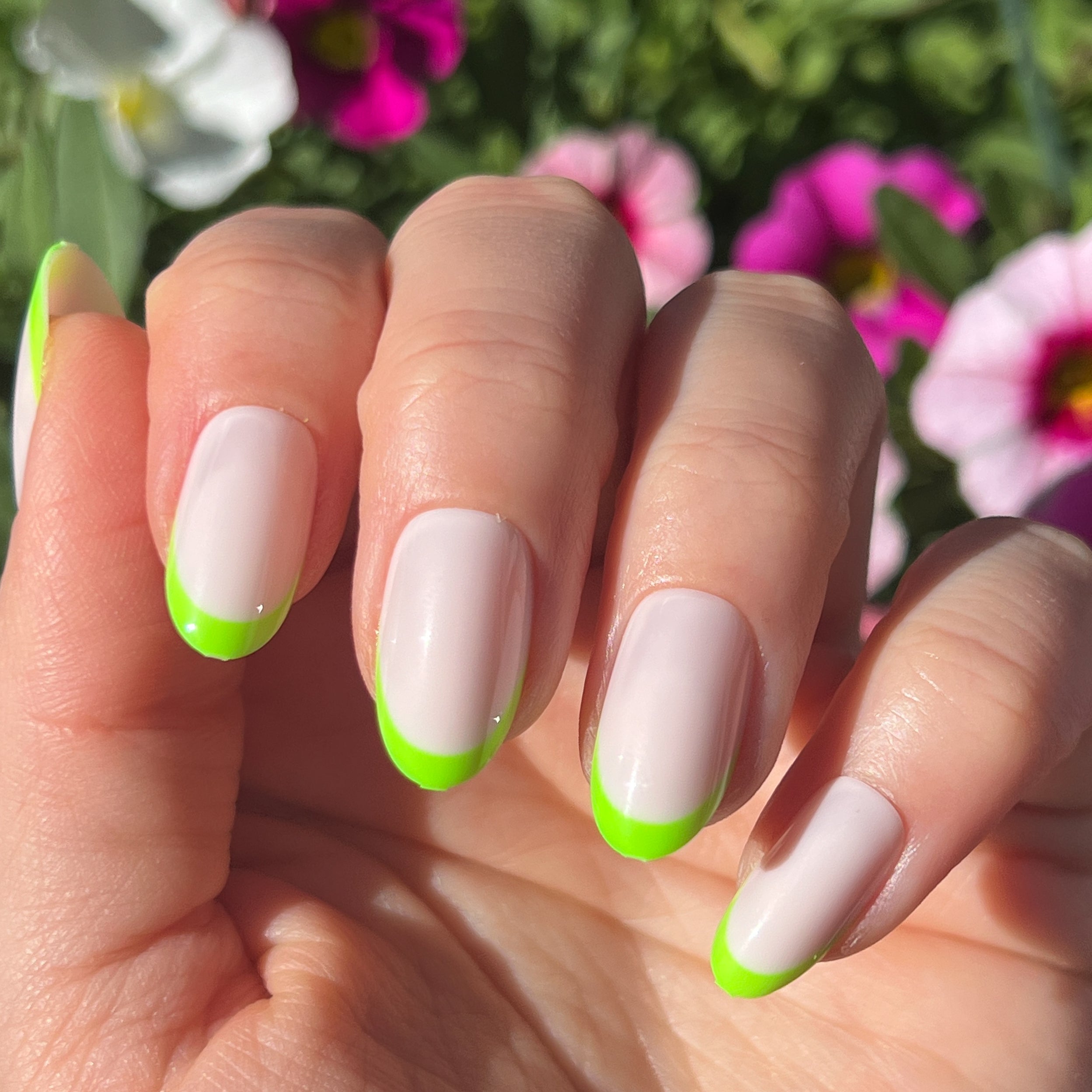 Neon Lime French | Oval | Medium press-on nails with a neutral base and vibrant neon lime tips for an easy at-home manicure