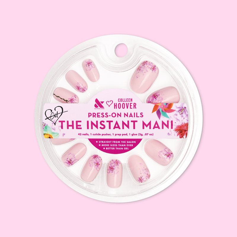 Blooming Lily - Press-On | Short | Round showing packaged pale pink nails with shattered lily design press-on manicure