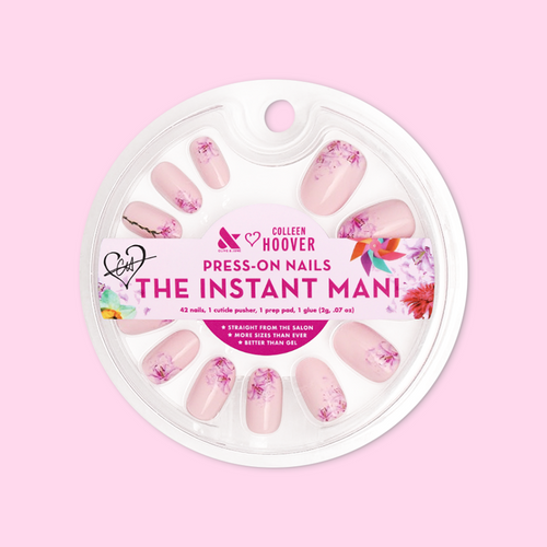 Blooming Lily - Press-On | Short | Round showing packaged pale pink nails with shattered lily design press-on manicure