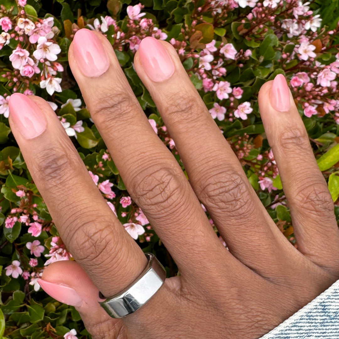 Blush Syrup Gradient - Press-On | Short | Almond showing hand with short almond-shaped warm blush gradient press-on manicure outdoors