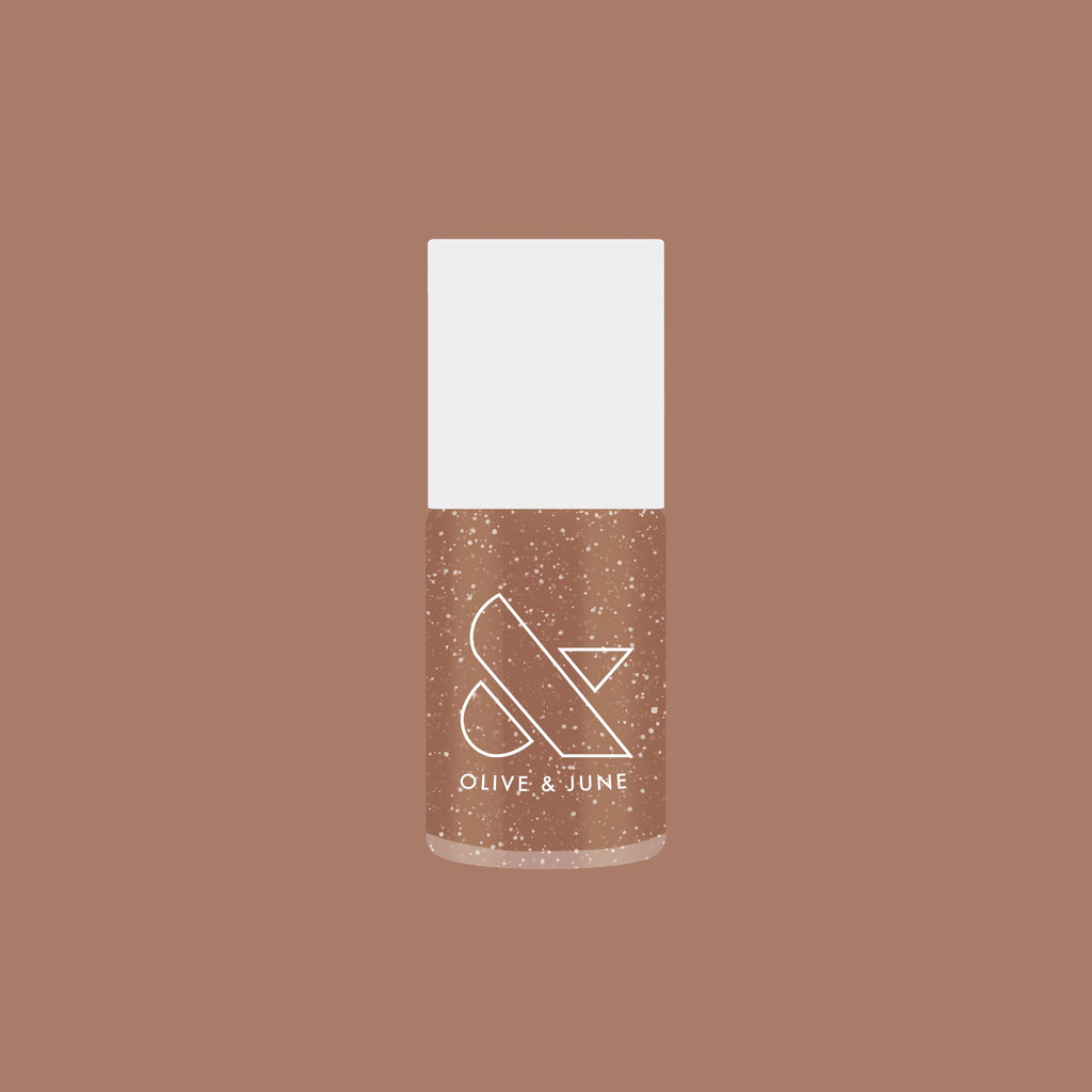 Olive and June bottle of Coconut Shimmer Gloss gel polish with warm chestnut base and silver shimmer on brown background
