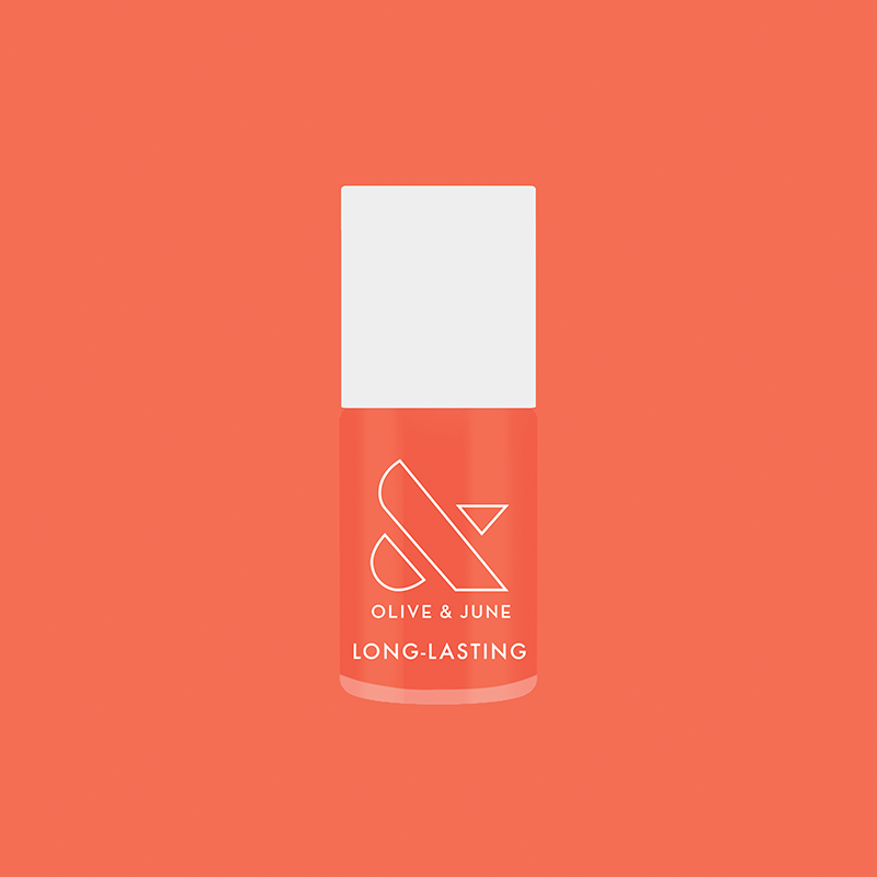 Olive and June Ride into the Sunset long-lasting gel polish bottle on matching coral background