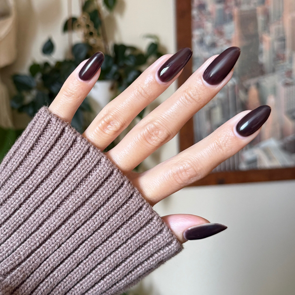 CN - Gel on long almond-shaped nails featuring a deep silky sable brown manicure by Olive and June
