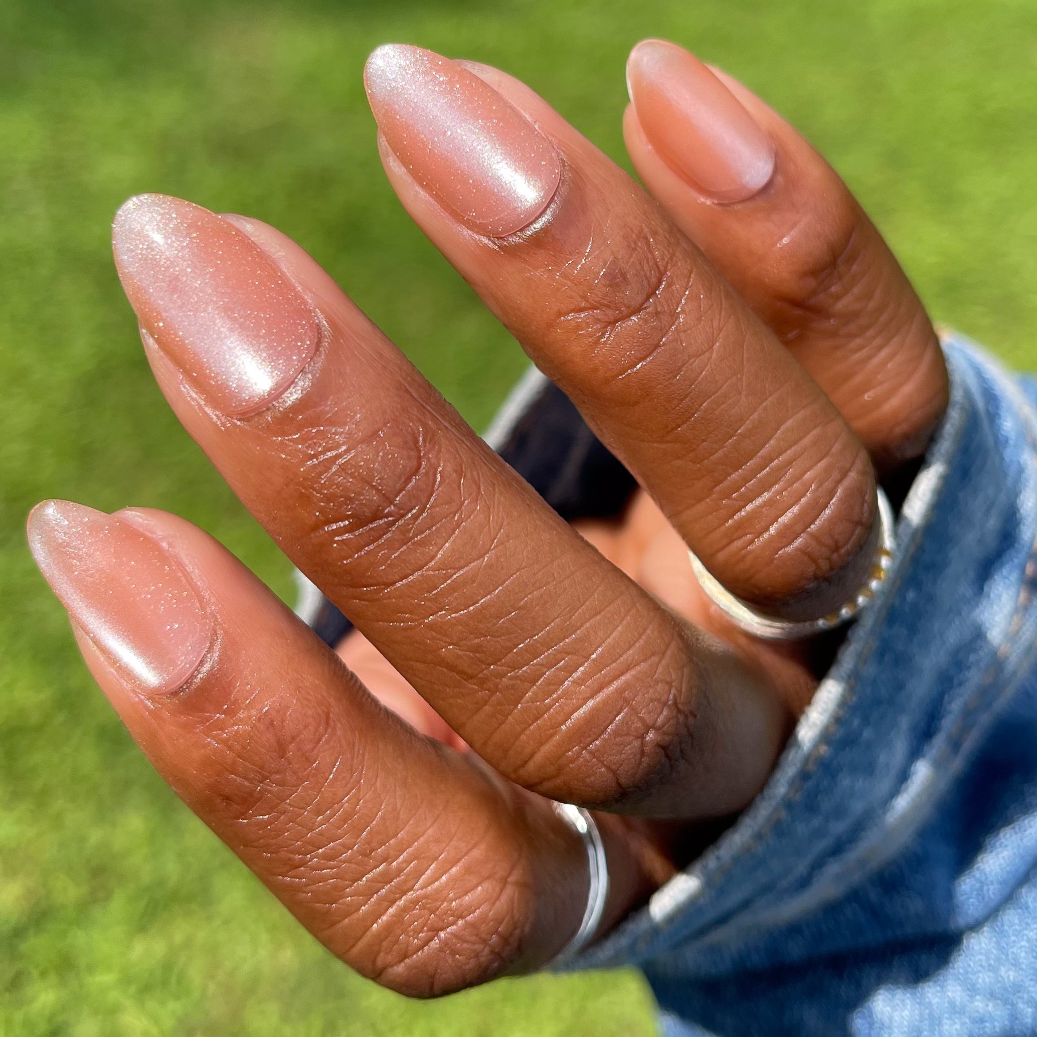 Velvet KAG - Press-On | Medium | Almond neutral peach velvet cateye finish on natural nails with denim sleeve background