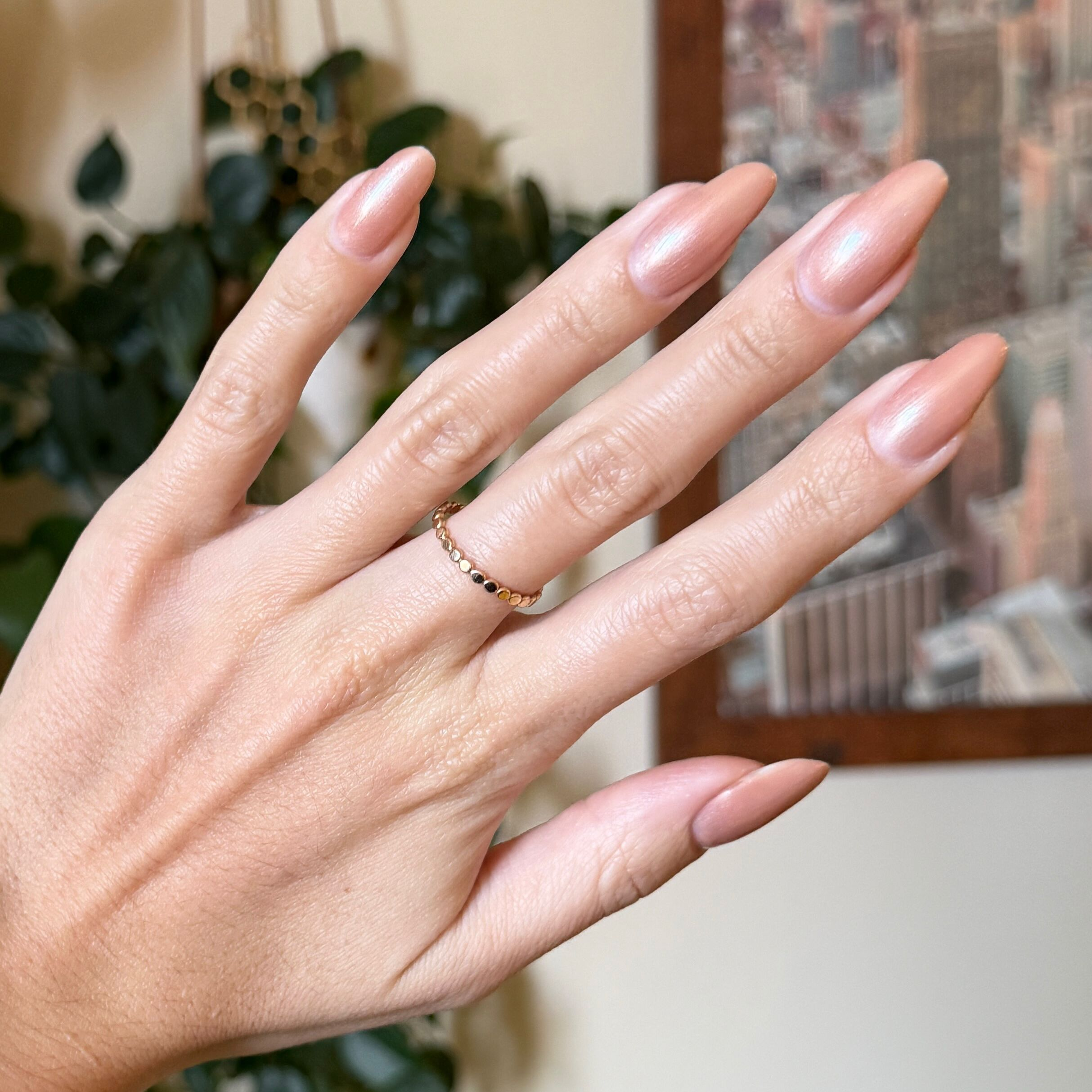 Cookie Swap Gel shimmery beige champagne gel polish on natural medium-length nails for a refined manicure by Olive and June