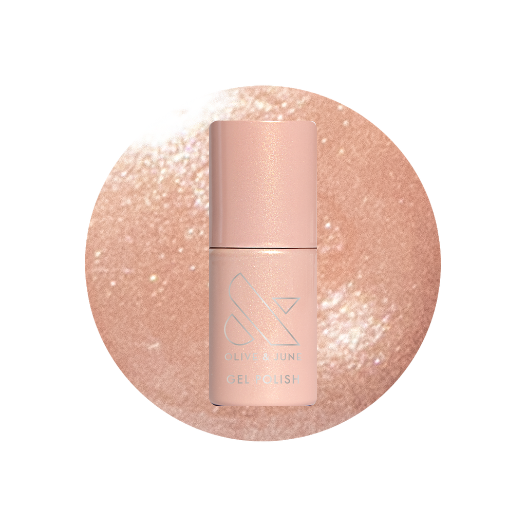 Cookie Swap Gel shimmery beige champagne gel polish bottle on sparkling background for a polished manicure