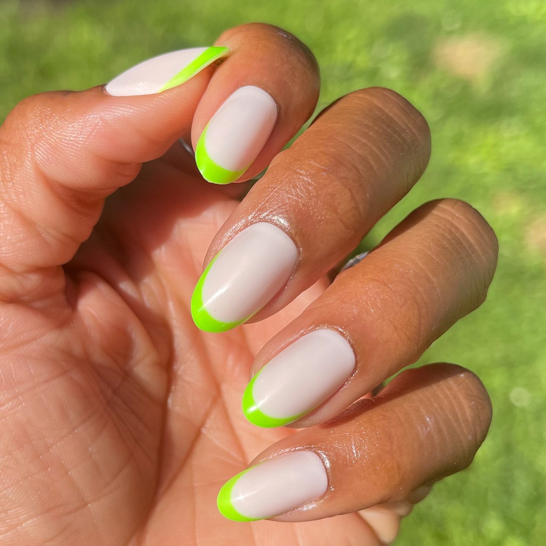 Neon Lime French | Oval | Medium press-on nails with a neutral base and bright neon lime tips for an easy manicure