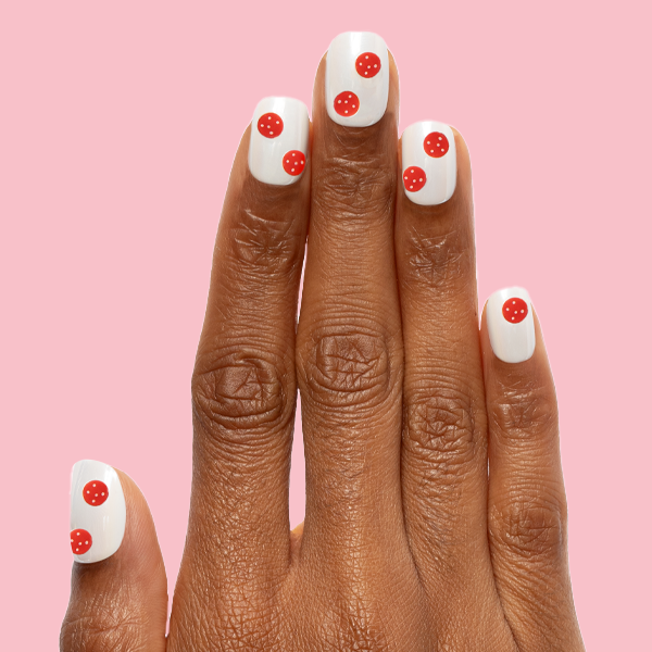 White Chrome - Press-On | Extra Short | Squoval off-white chrome mani with red pizza topping nail art on fingers against pink background