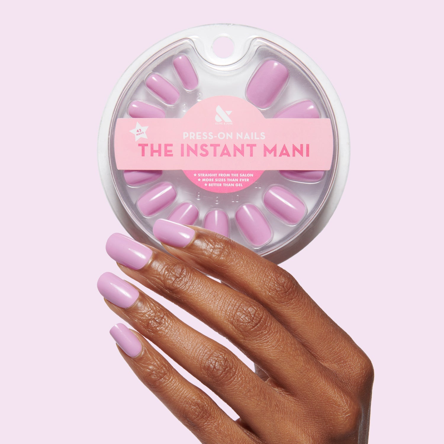 Hand with Fierce & Loving | Squoval | Short lilac short squoval press-on nails holding matching press-ons set