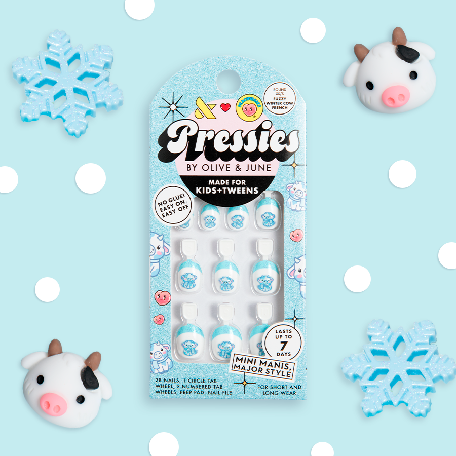 Fuzzy Winter Cow French - Pressies | Extra Short Short | Round showing blue false nails with fuzzy cow design in packaging