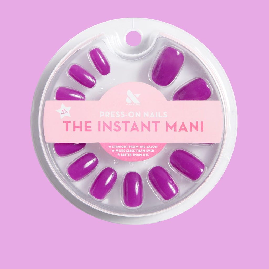 Grape Soda | Round | Short press-on nails in vibrant neon purple with a glossy finish in circular packaging