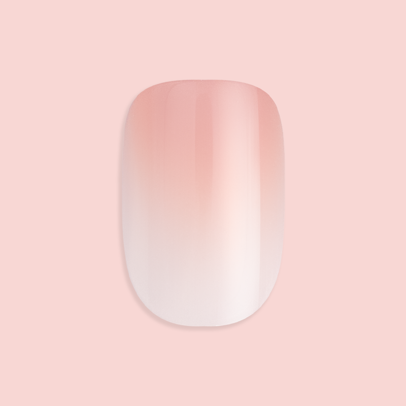 BI Syrup Gradient - Press-On | Extra Short | Round showing a single extra short round false nail with peachy pastel gradient polish