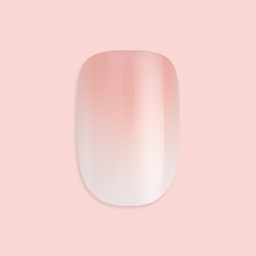 BI Syrup Gradient - Press-On | Extra Short | Round showing a single extra short round false nail with peachy pastel gradient polish