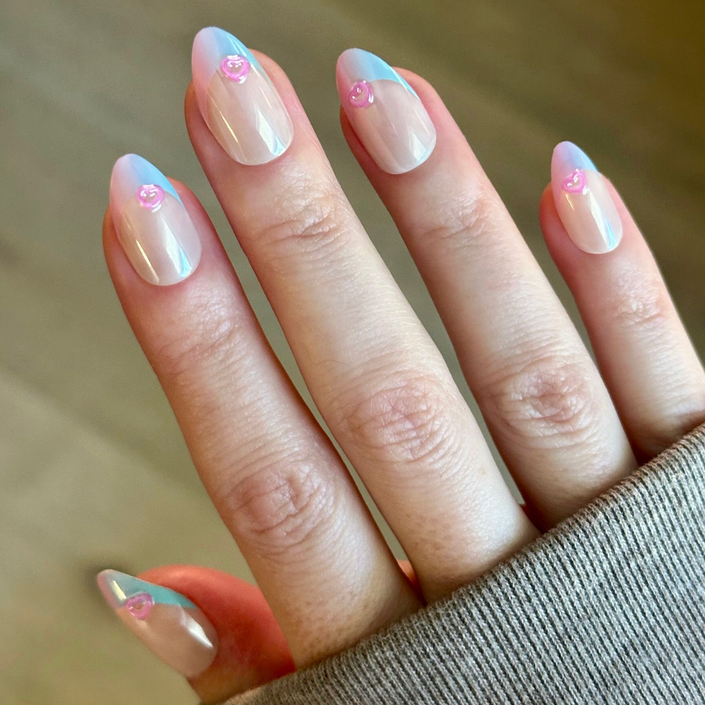 Kawaii Cow Chrome French - Press-On | Medium | Almond showing nails with pastel blue chrome French tips and small 3D pink heart accents