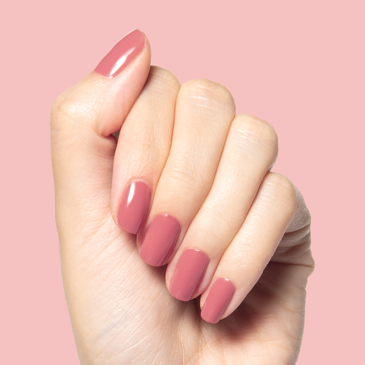 Boysenberry Glass gel polish on short nails showing a sheer berry jelly manicure by Olive and June