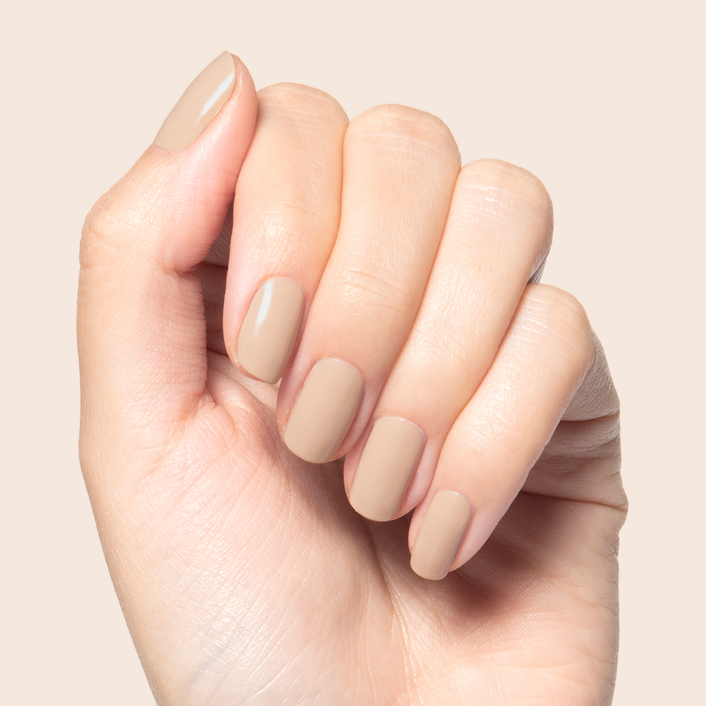 Real Toasty neutral beige nail polish shown on hand for a cozy, natural mani with long-lasting finish at home