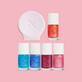 Mini Goldfish Iridescent Set with five shimmering nail polishes and a pink mani stabilizer for neat at home manicures