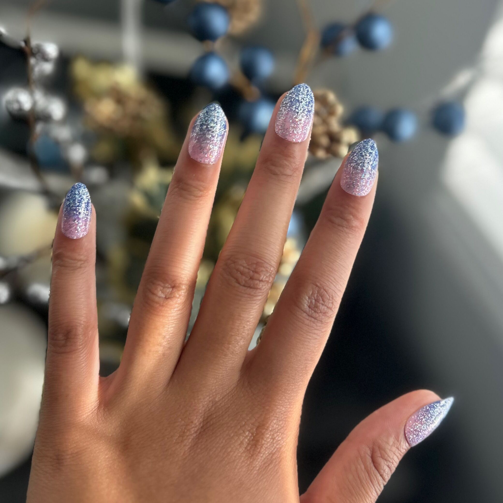 Hand with Major Glitter Gradient - Press On | Medium | Almond showing sparkly blue and pink flash glitter gradient press-on mani in medium almond shape