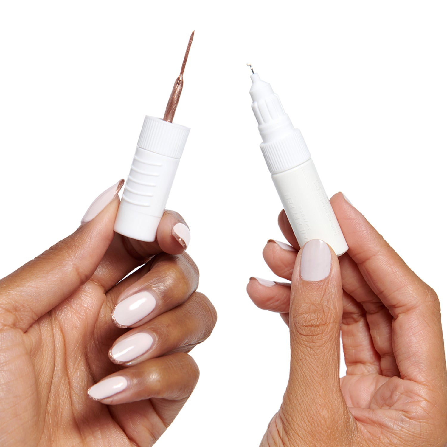 Nail Art Pen - HD in crisp white held open to show dual tips for precise at-home mani designs with long-lasting polish