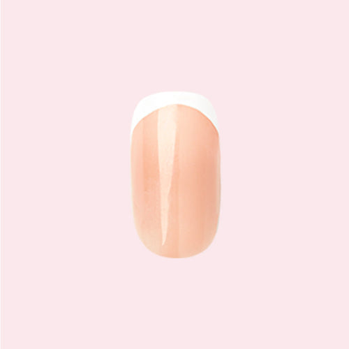Classic French - Press-On | Extra Short | Squoval nail with neutral peachy pink base and crisp white tip on pale pink background