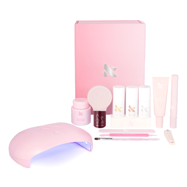 Obsessed Gel Mani System with dark ruby gel polish, LED lamp, base coat, and manicure tools for salon-quality at-home manicure
