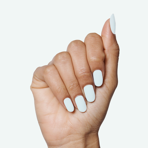 Hand with pale icy blue nails showing a smooth long-lasting manicure using Angelfish nail polish
