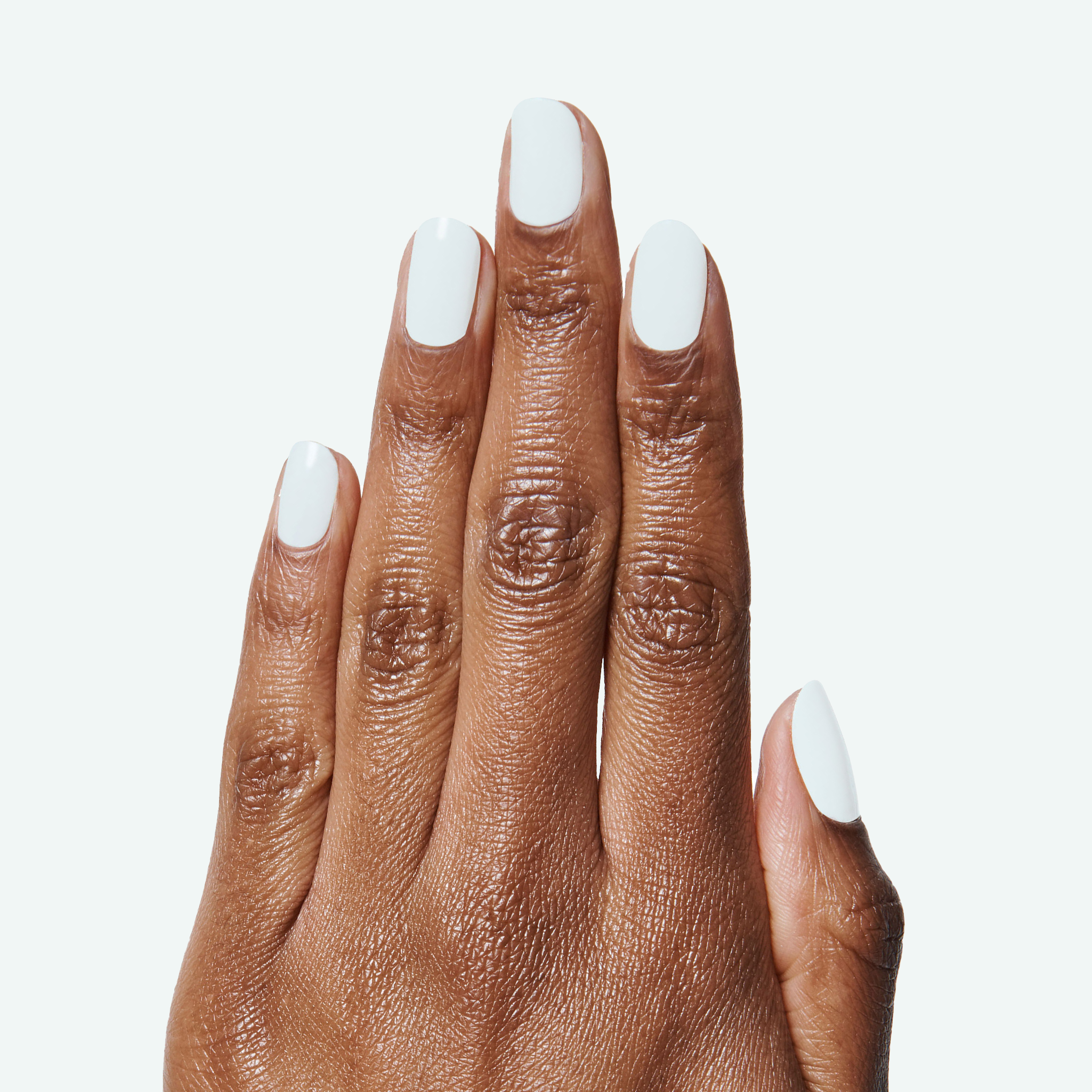 Hand with smooth pale sky-blue nails showing a long-lasting Angelfish gel polish manicure by Olive and June