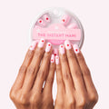 Pink Perfect Heart - Press-On | Round | Short with soft pink and red heart design on natural nails and press-on pack shown above