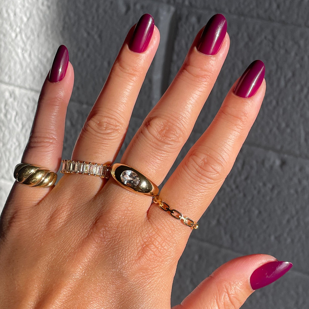 Plaza | Oval | Medium deep mulberry purple press-on manicure with medium oval false nails for a sleek at-home mani