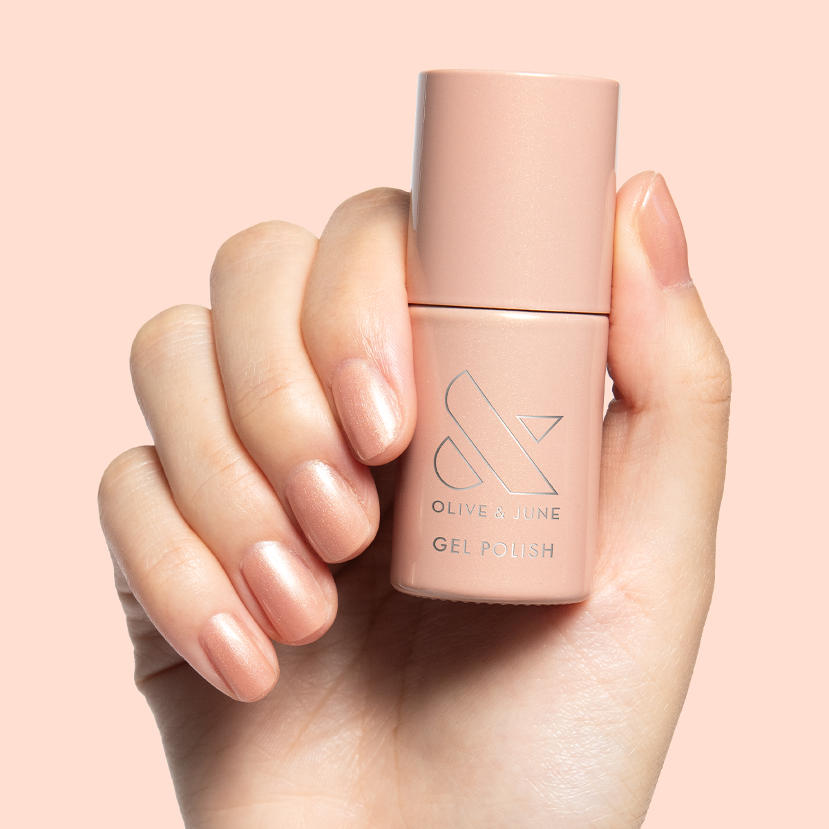 Cookie Swap Gel shimmering beige champagne gel polish on short natural nails for a subtle manicure by Olive and June