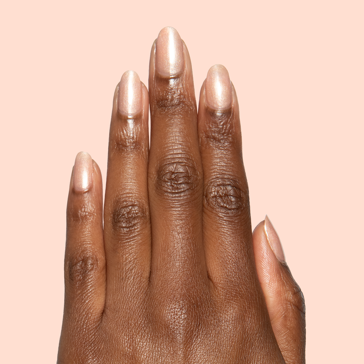 Cookie Swap Gel shimmery beige champagne gel polish on medium-length natural nails for a polished manicure