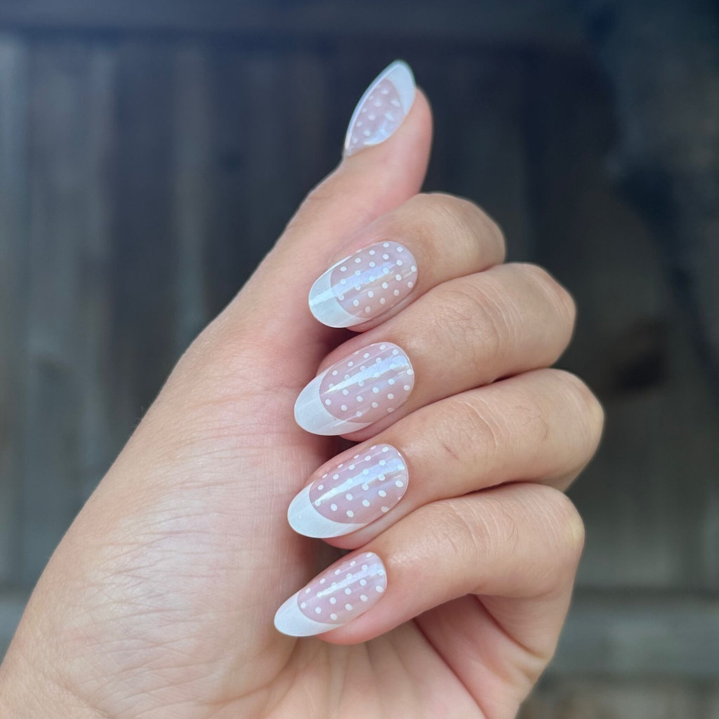 Polka Dot Tights - Press-On | Medium | Oval oval false nails with chrome french tips and delicate white polka dots manicure