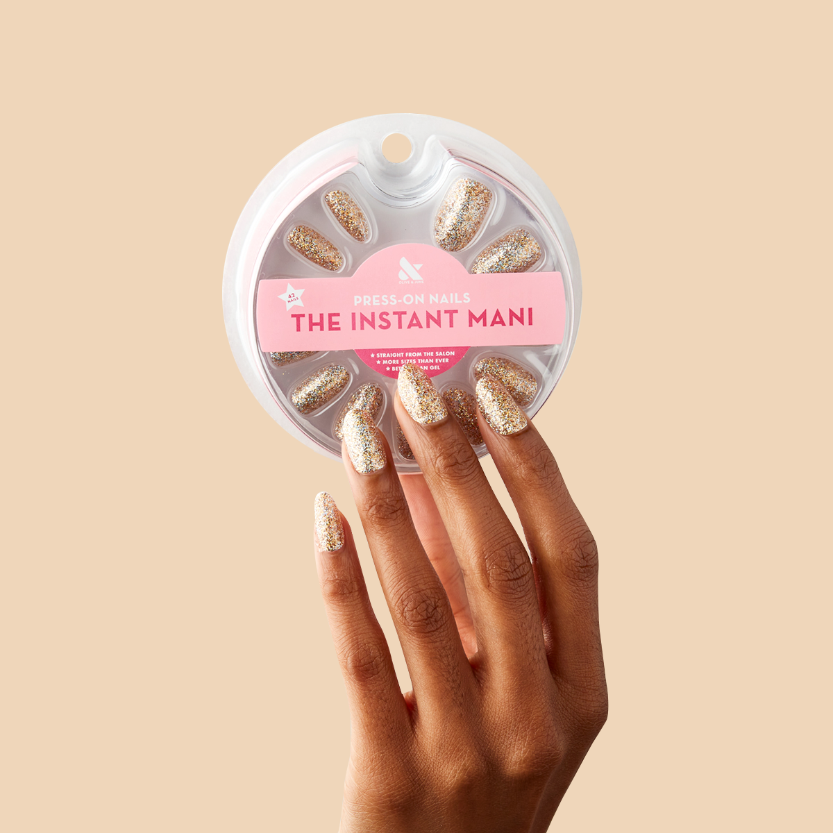 OBVI - Press-On | Medium | Oval hand featuring medium oval false nails with gold glitter polish for a festive mani