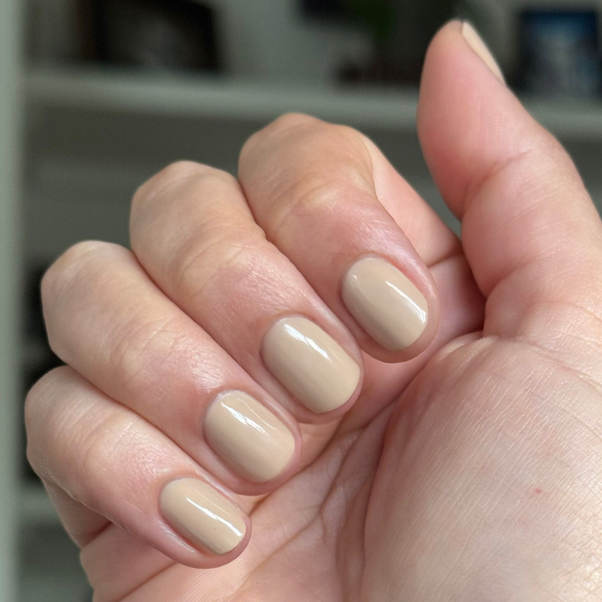 Real Toasty neutral beige gel polish on nails for a cozy, long-lasting at-home manicure look