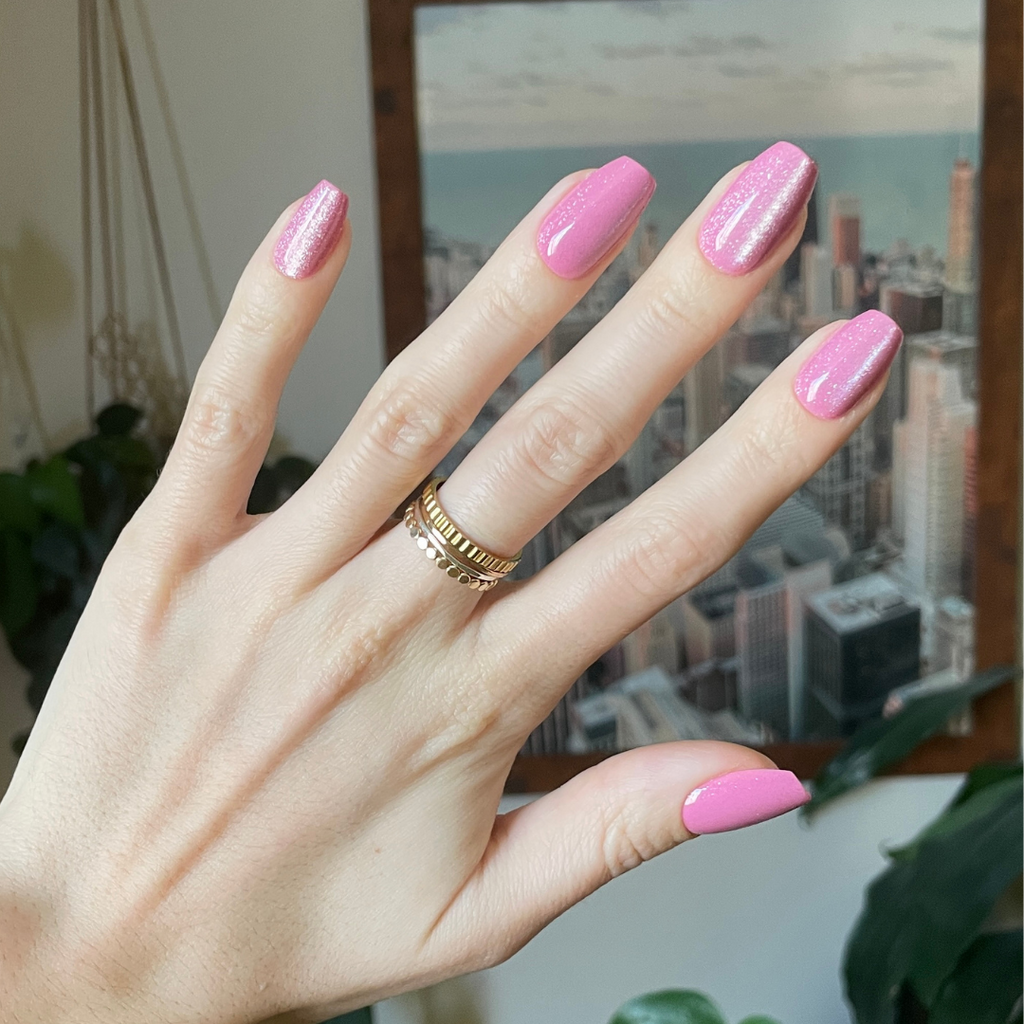 Rose Velvet - Press-On | Medium | Coffin showing hand with shimmering pink velvet textured medium coffin false nails on city background