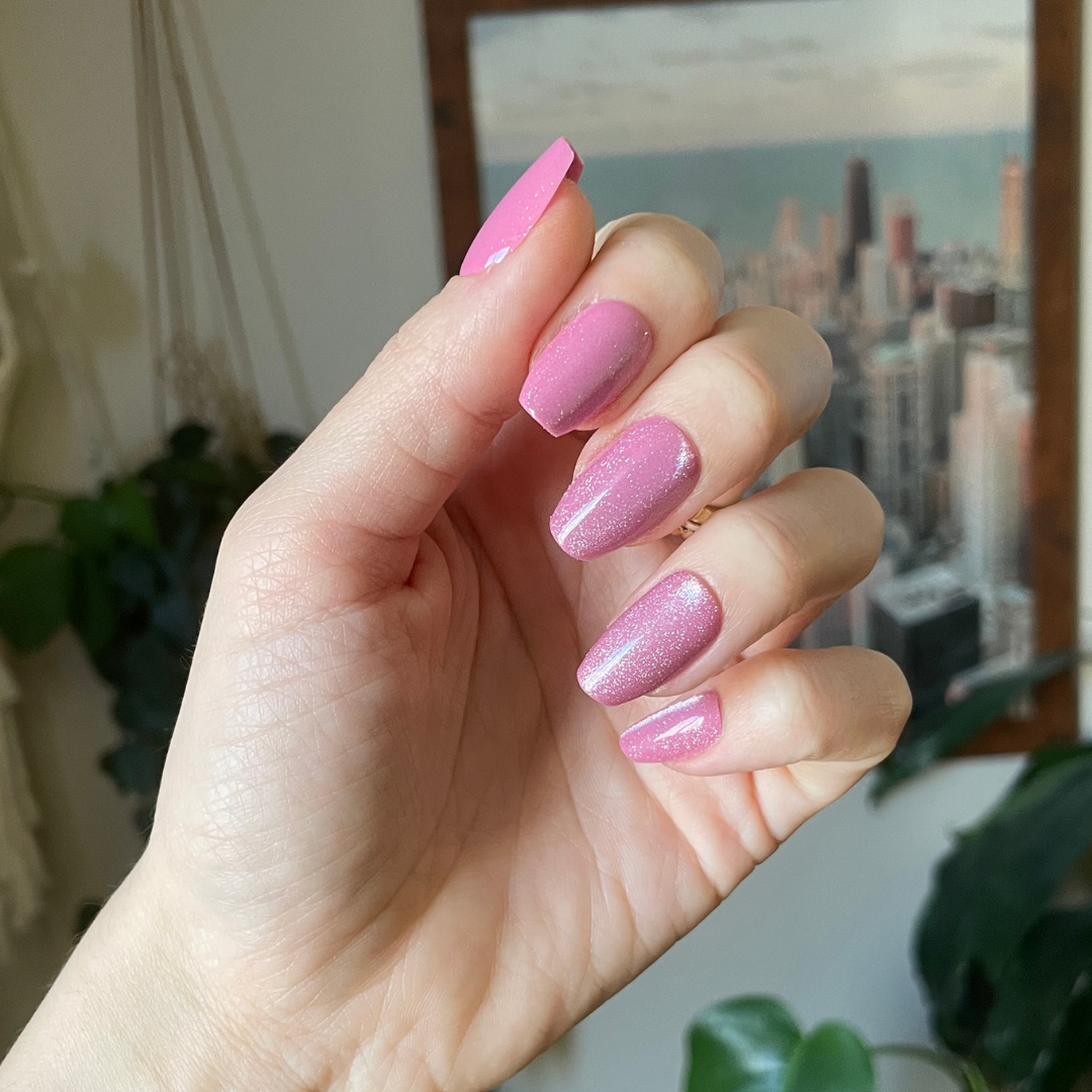Rose Velvet - Press-On | Medium | Coffin showing hand with soft shimmering pink velvet medium coffin false nails indoors