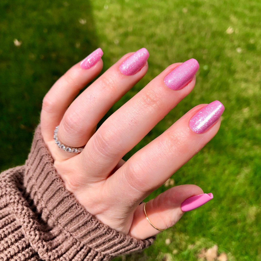 Rose Velvet - Press-On | Medium | Coffin showing hand outdoors with shimmering pink velvet textured medium coffin false nails