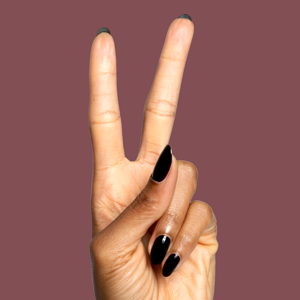 Shop Til You Drop deep vampy red gel polish on natural nails in a sleek manicure by Olive and June