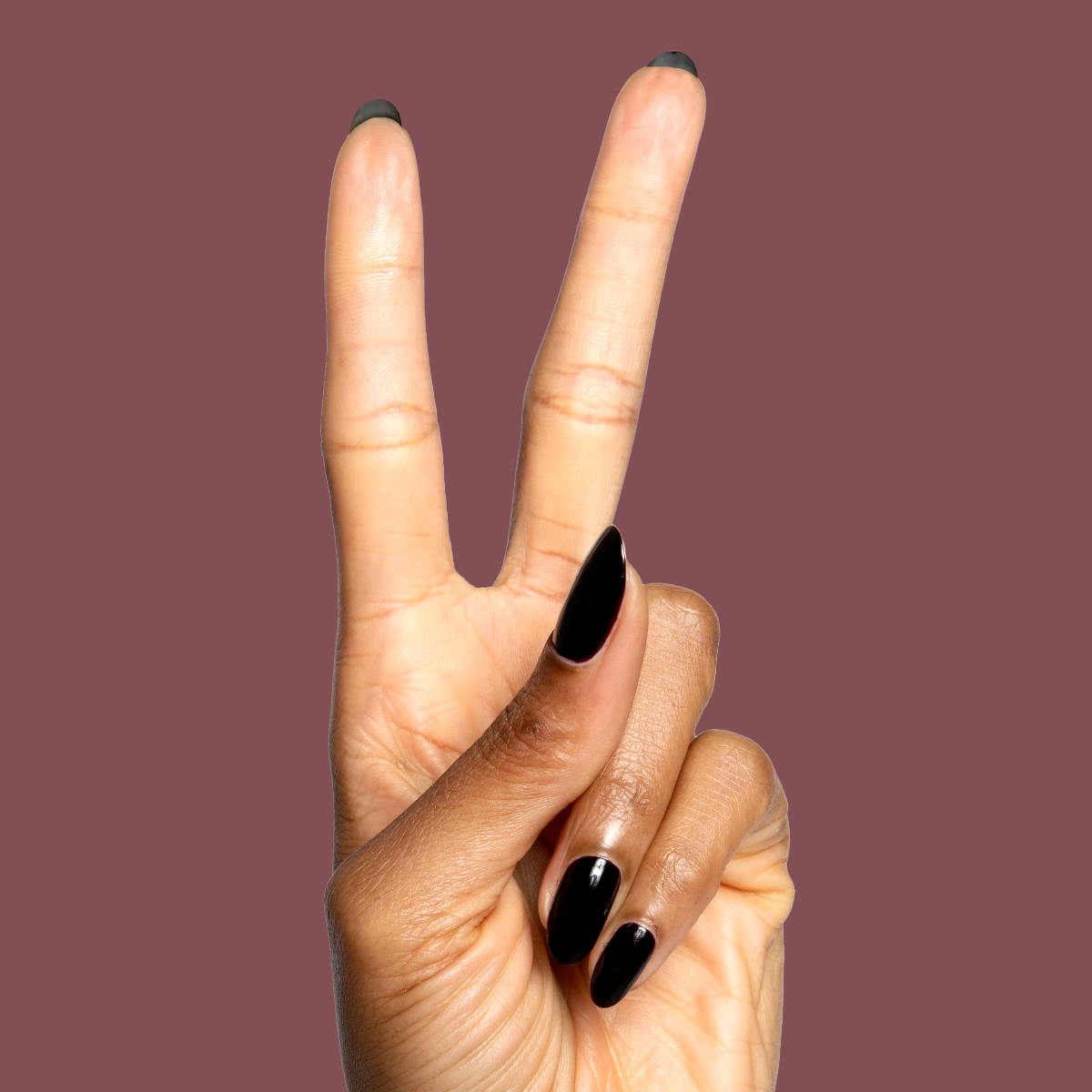 Shop Til You Drop deep vampy red gel polish on natural nails in a sleek manicure by Olive and June
