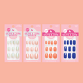 Spring/Summer ‘25 Super Stick Set with four sets of round false nails in soft green, nude, coral, and blue shades for easy at-home mani