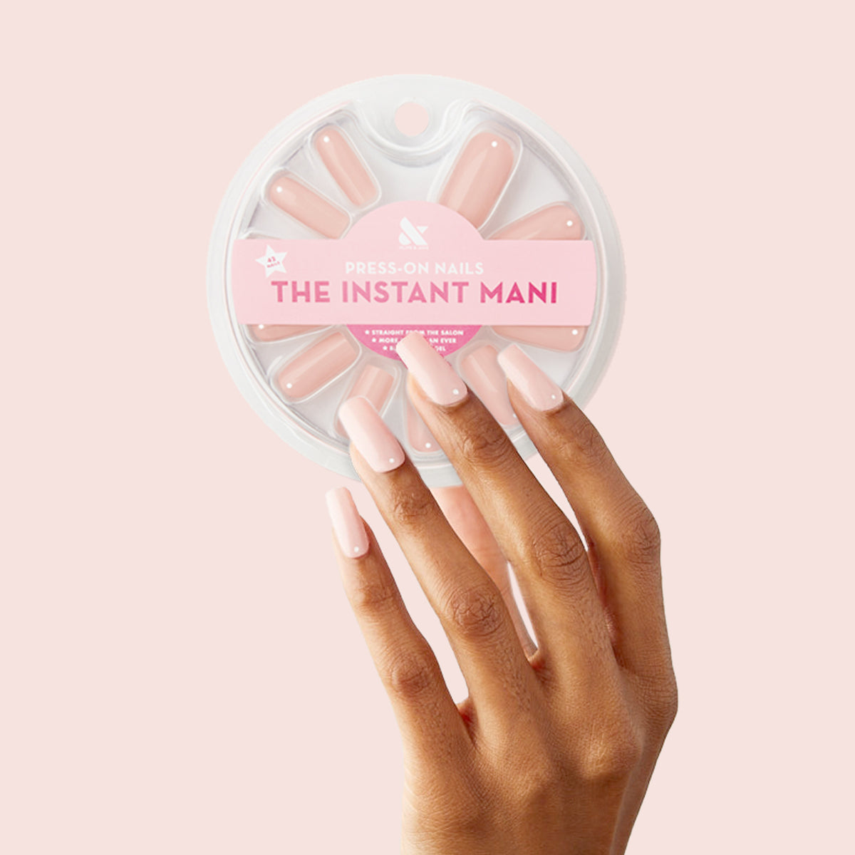 Minimalist Dot - Press-On | Long | Squoval long sheer tan press-on nails with white accent on hand against light background