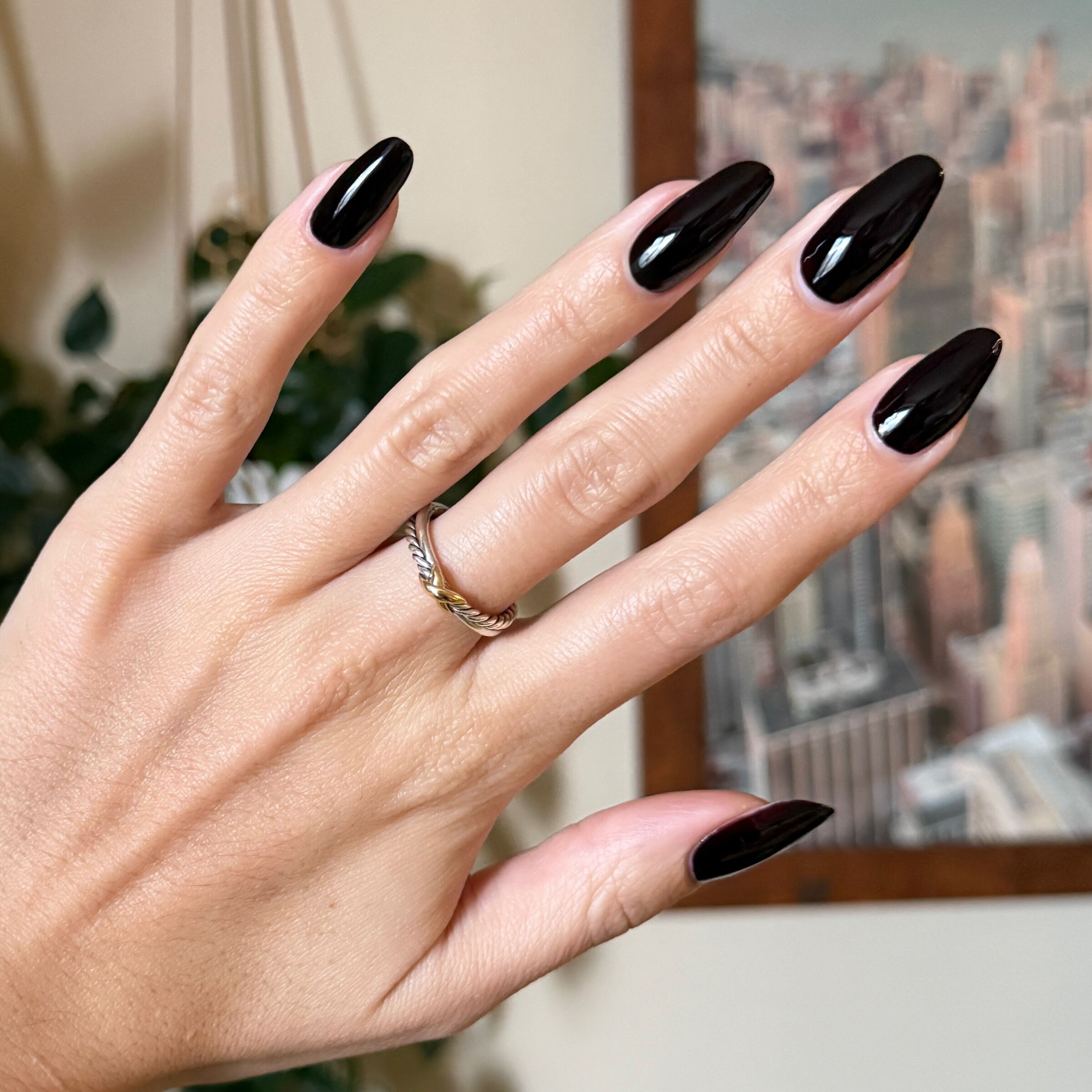 Shop Til You Drop deep vampy red gel polish on long almond-shaped nails for a sleek manicure by Olive and June