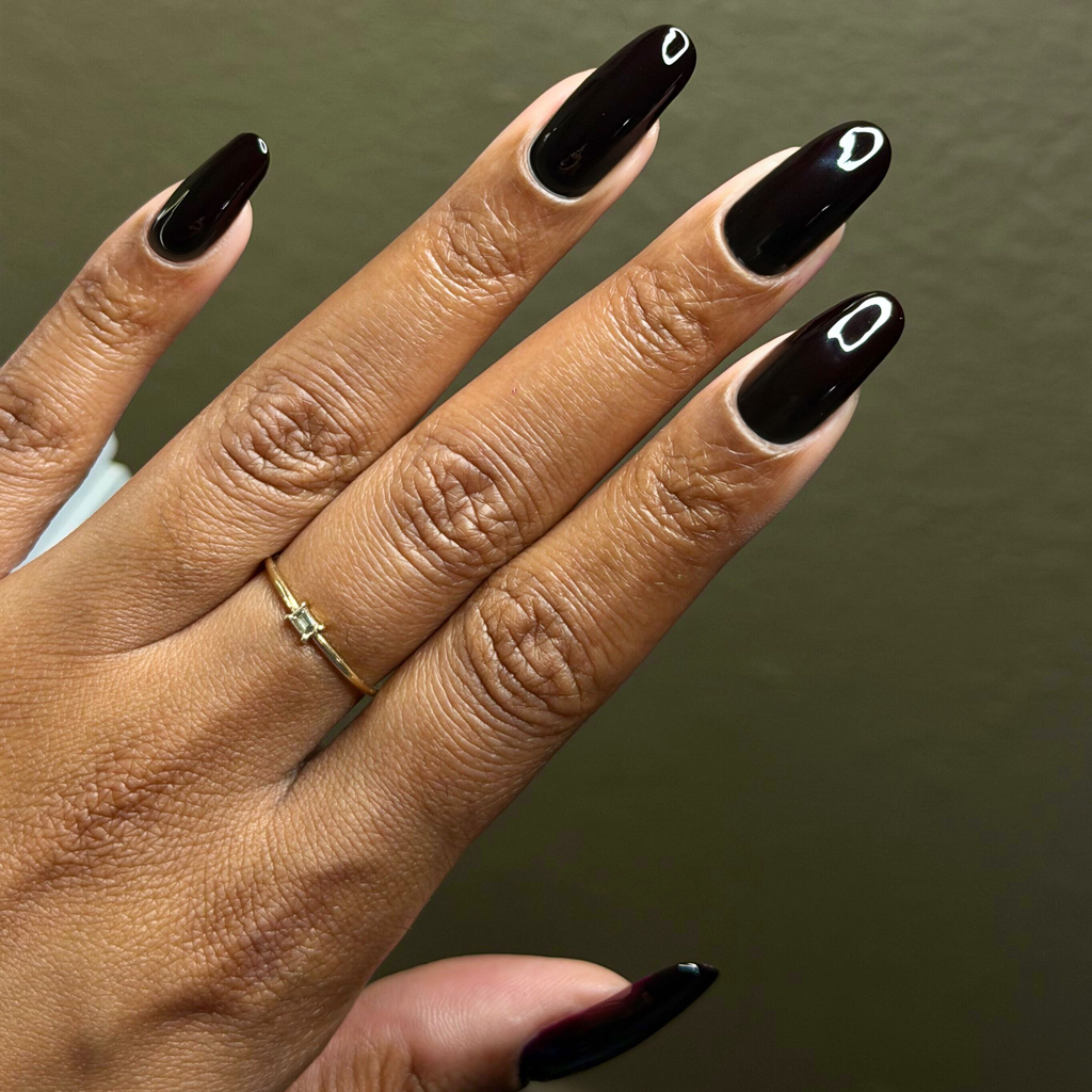 Shop Til You Drop vampy dark red gel polish on long nails with a glossy finish for a chic manicure by Olive and June
