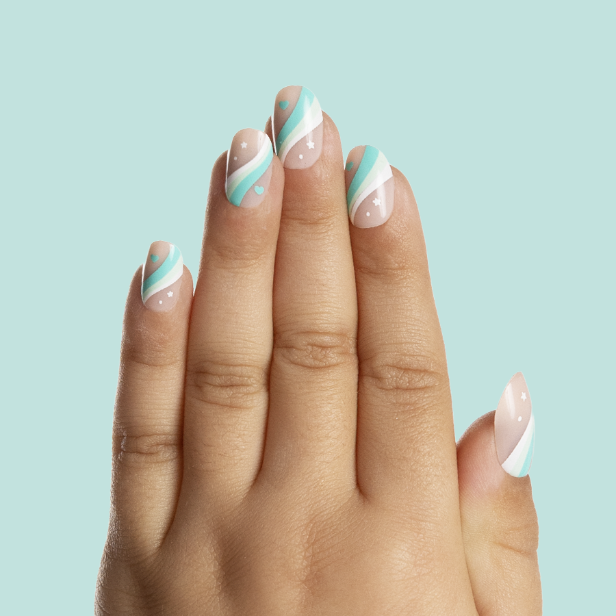 Totally Teal Swirls - Pressies | Short Medium | Round showing hand with teal, white swirled press on nails with stars and hearts design