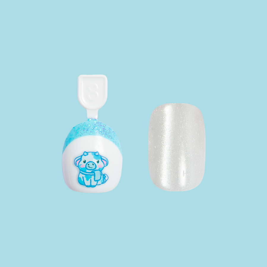 Winter Cow Set showing two press-on nails with a blue cow design and glittery white polish for quick mani sessions