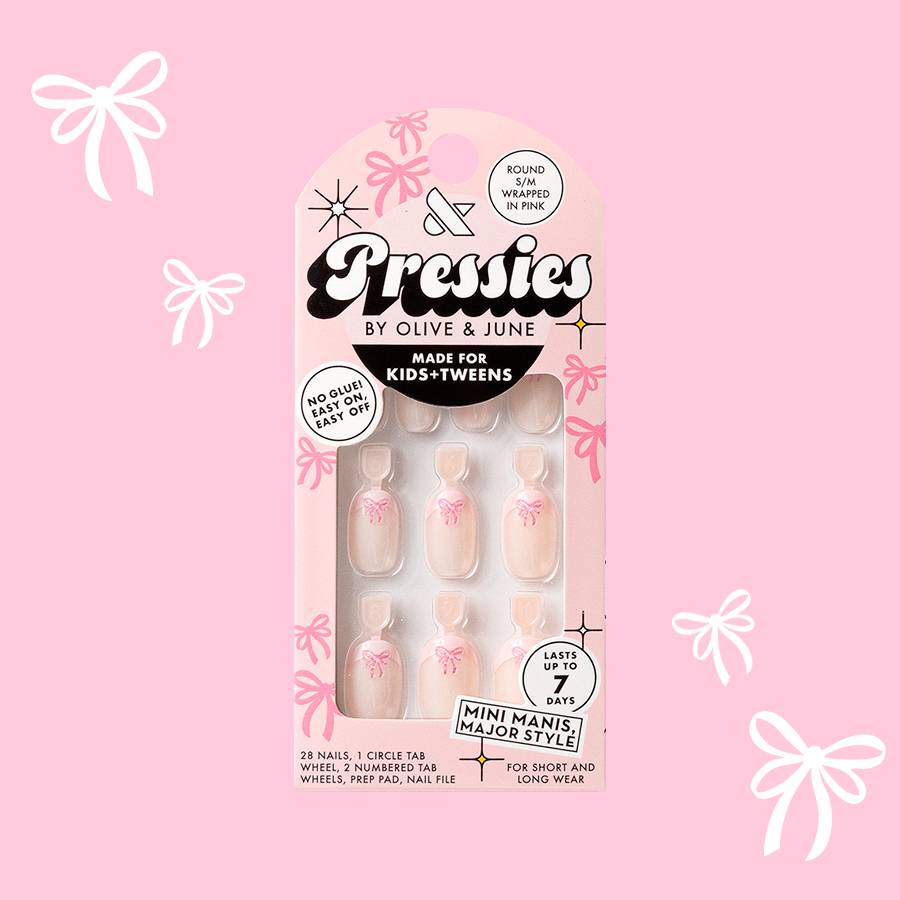 Wrapped in Pink - Pressies | Short Medium | Round showing baby pink french mani with 3D pink bow press-on nails in packaging